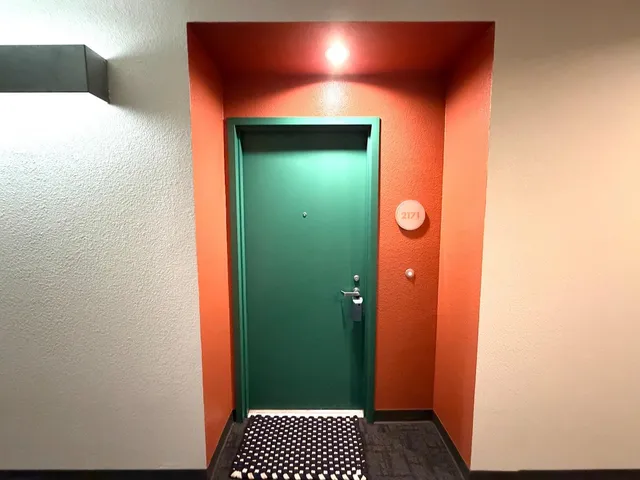 a room with pool table and windows