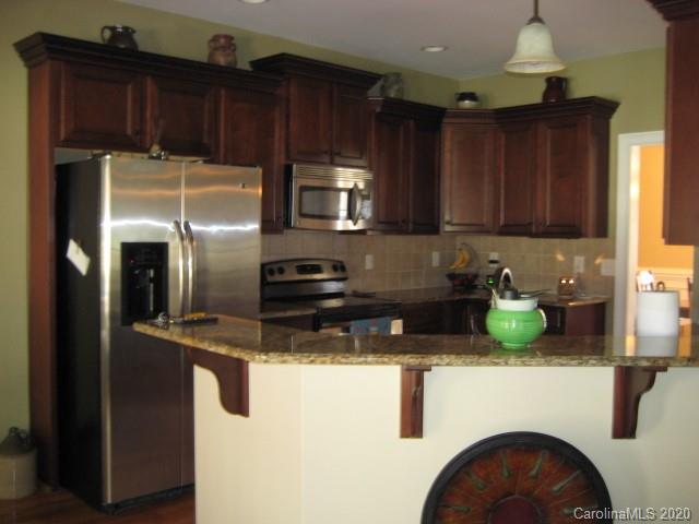 4014 Ruston Creek Road, Unit 86 Catawba, SC 29704 - Photo 12 of 48 a kitchen with refrigerator and cabinets