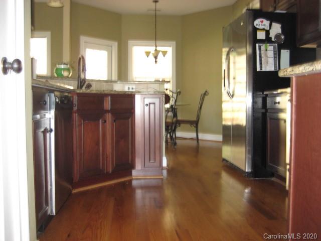 4014 Ruston Creek Road, Unit 86 Catawba, SC 29704 - Photo 13 of 48 a view of a kitchen with furniture window and wooden floor
