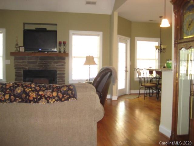 4014 Ruston Creek Road, Unit 86 Catawba, SC 29704 - Photo 15 of 48 a living room with fireplace furniture and a flat screen tv