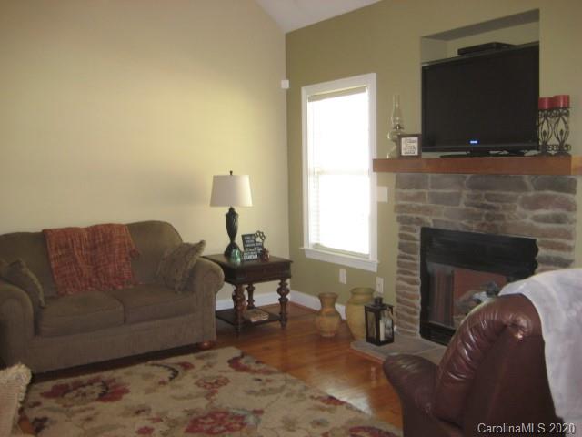 4014 Ruston Creek Road, Unit 86 Catawba, SC 29704 - Photo 17 of 48 a living room with furniture and a fireplace
