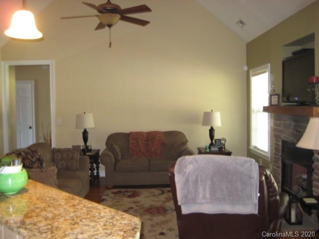 4014 Ruston Creek Road, Unit 86 Catawba, SC 29704 - Photo 18 of 48 a living room with furniture and a fireplace