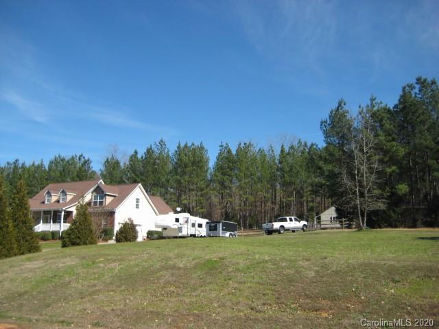 4014 Ruston Creek Road, Unit 86 Catawba, SC 29704 - Photo 3 of 48 a view of a big house with a big yard and large trees