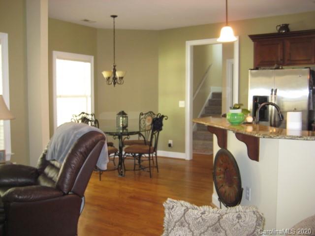 4014 Ruston Creek Road, Unit 86 Catawba, SC 29704 - Photo 23 of 48 a living room with furniture a window and a chandelier