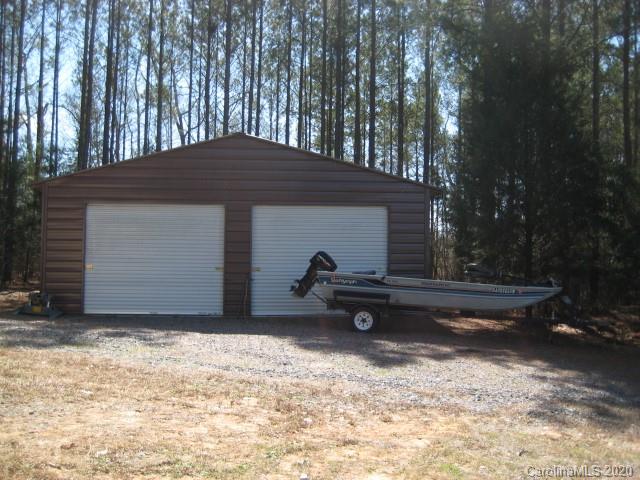 4014 Ruston Creek Road, Unit 86 Catawba, SC 29704 - Photo 39 of 48 a backyard of a house with barbeque oven table and chairs