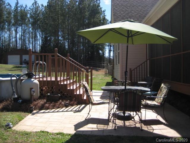 4014 Ruston Creek Road, Unit 86 Catawba, SC 29704 - Photo 48 of 48 a view of balcony with chairs and umbrella