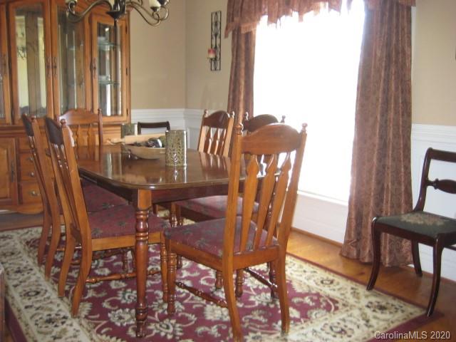 4014 Ruston Creek Road, Unit 86 Catawba, SC 29704 - Photo 8 of 48 a view of a dining room with furniture and wooden floor