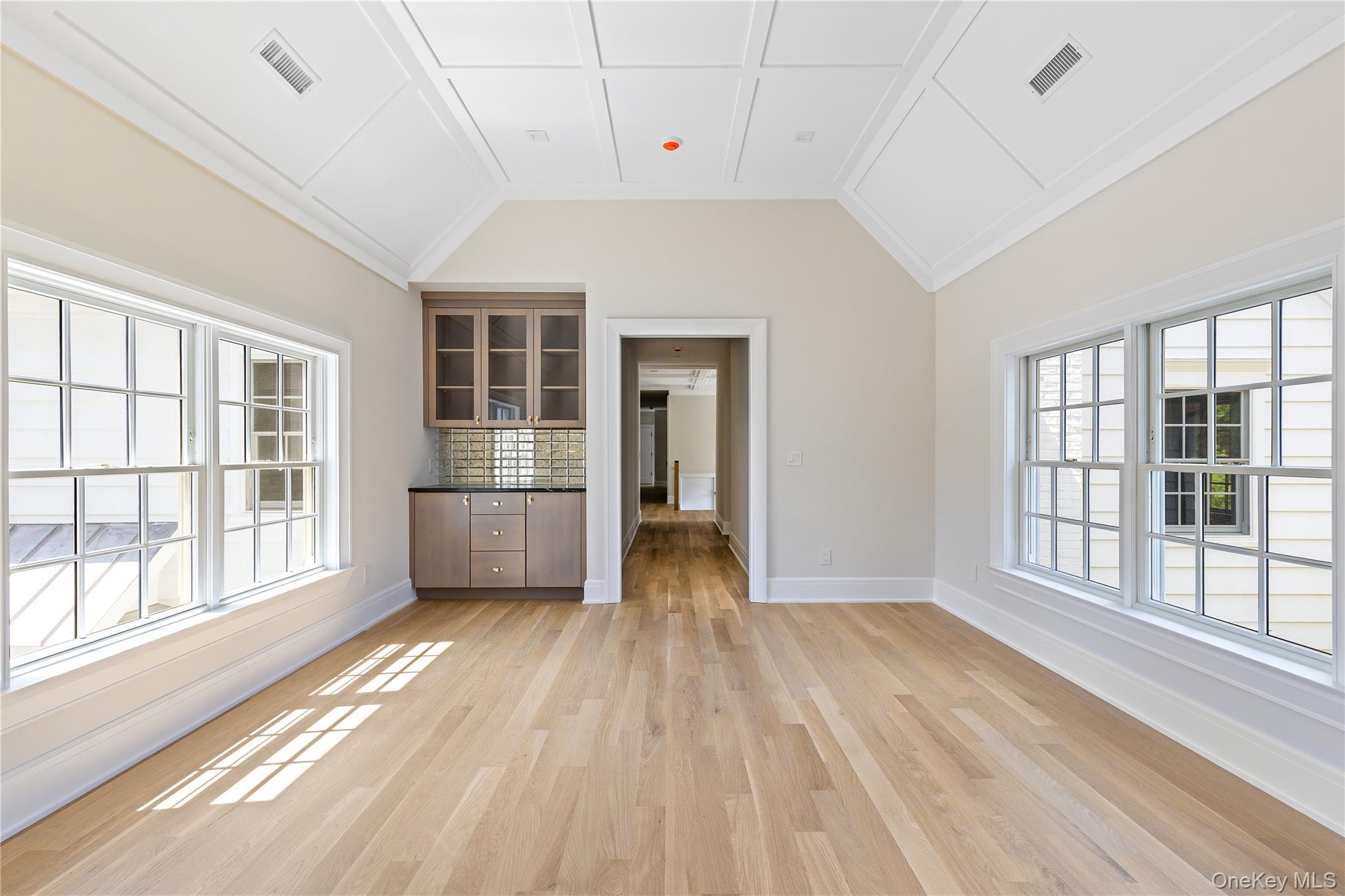 42 Mamaroneck Road Scarsdale, NY 10583 - Photo 33 of 47 The spacious guest suite includes a private sitting room with a beverage refrigerator (added after photo taken), creating an ideal retreat for overnight guests or extended family.