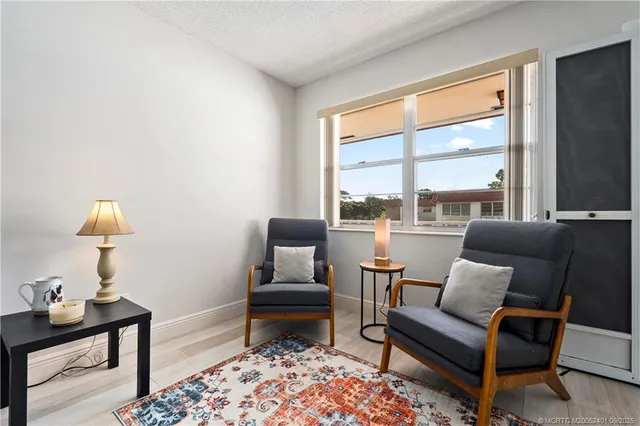 a living room with furniture and a rug