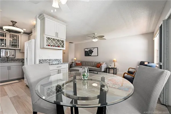 a bathroom with a sink vanity mirror and toilet