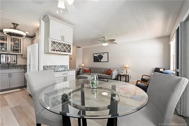 a bathroom with a sink vanity mirror and toilet