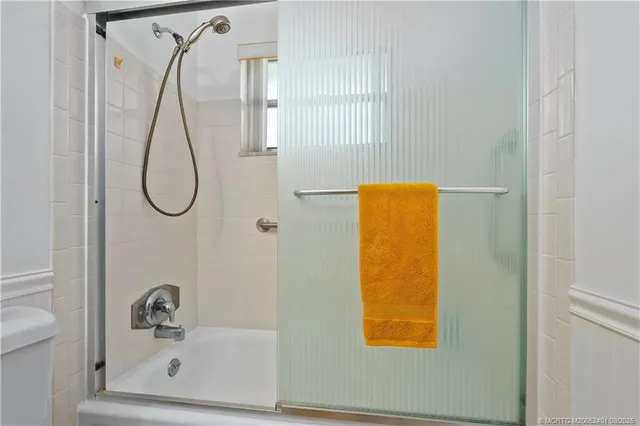 a living room with large windows