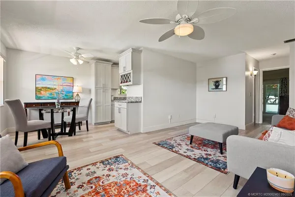 a living room with furniture and a rug
