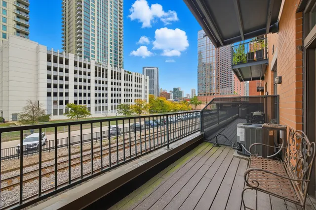 a view of balcony with wooden floor
