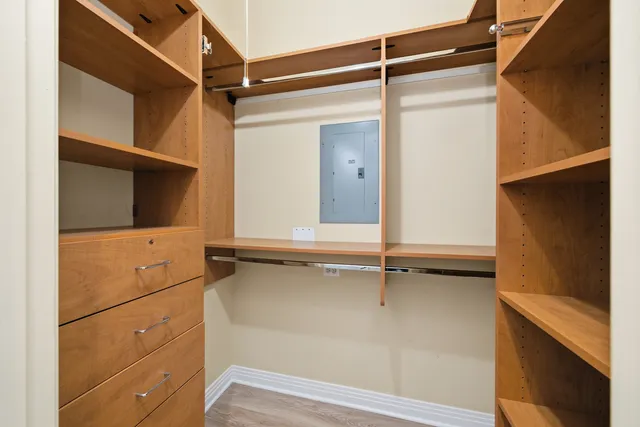 a view of walk in closet with empty racks