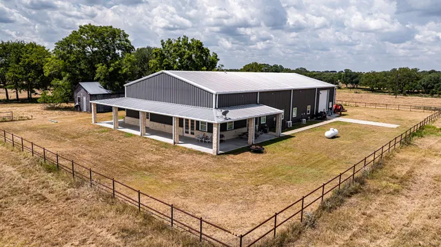 a view of a house with roof deck front of house