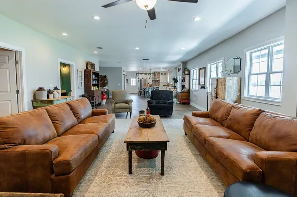 a living room with furniture and a fireplace