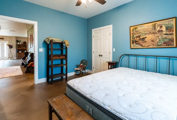 a bedroom with two beds and a window