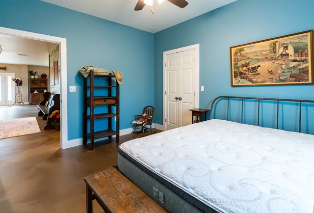 a bedroom with a bed and a dresser