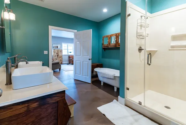 a bathroom with a sink toilet and shower