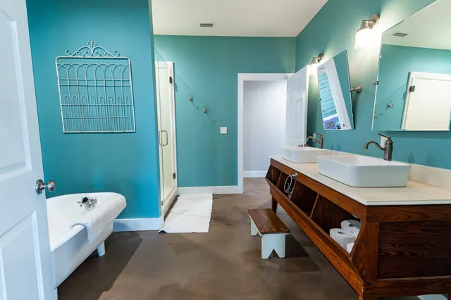 a bathroom with a sink double vanity and a mirror