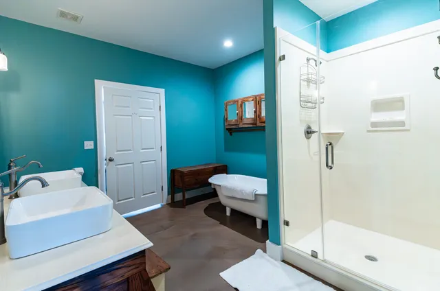 a bathroom with a sink toilet and shower