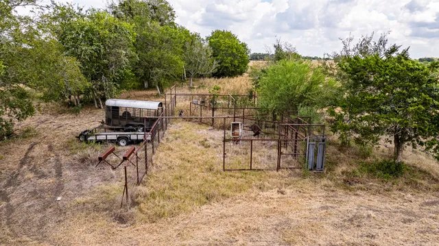 a view of a backyard with sitting area