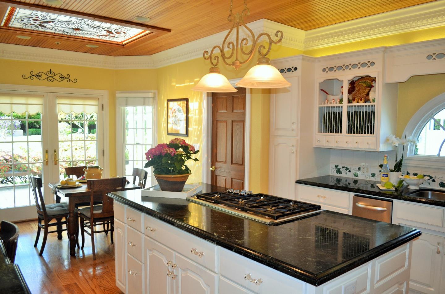 385 Tolak Road Aptos, CA 95003 - Photo 21 of 82 a kitchen with a stove a sink and a dining table
