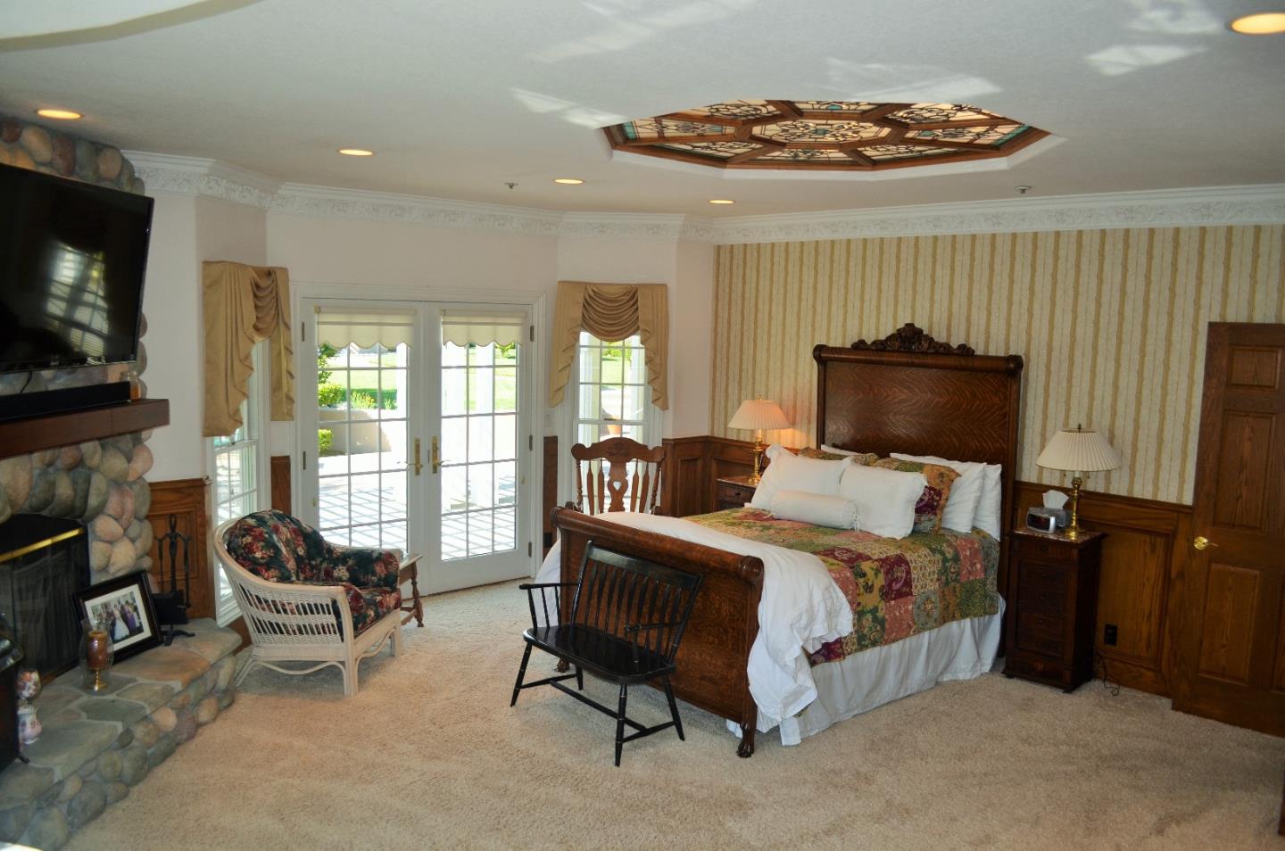 385 Tolak Road Aptos, CA 95003 - Photo 39 of 82 a bedroom with furniture and a flat screen tv