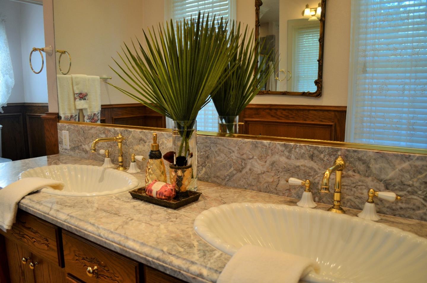 385 Tolak Road Aptos, CA 95003 - Photo 40 of 82 a bathroom with a granite countertop sink and a mirror