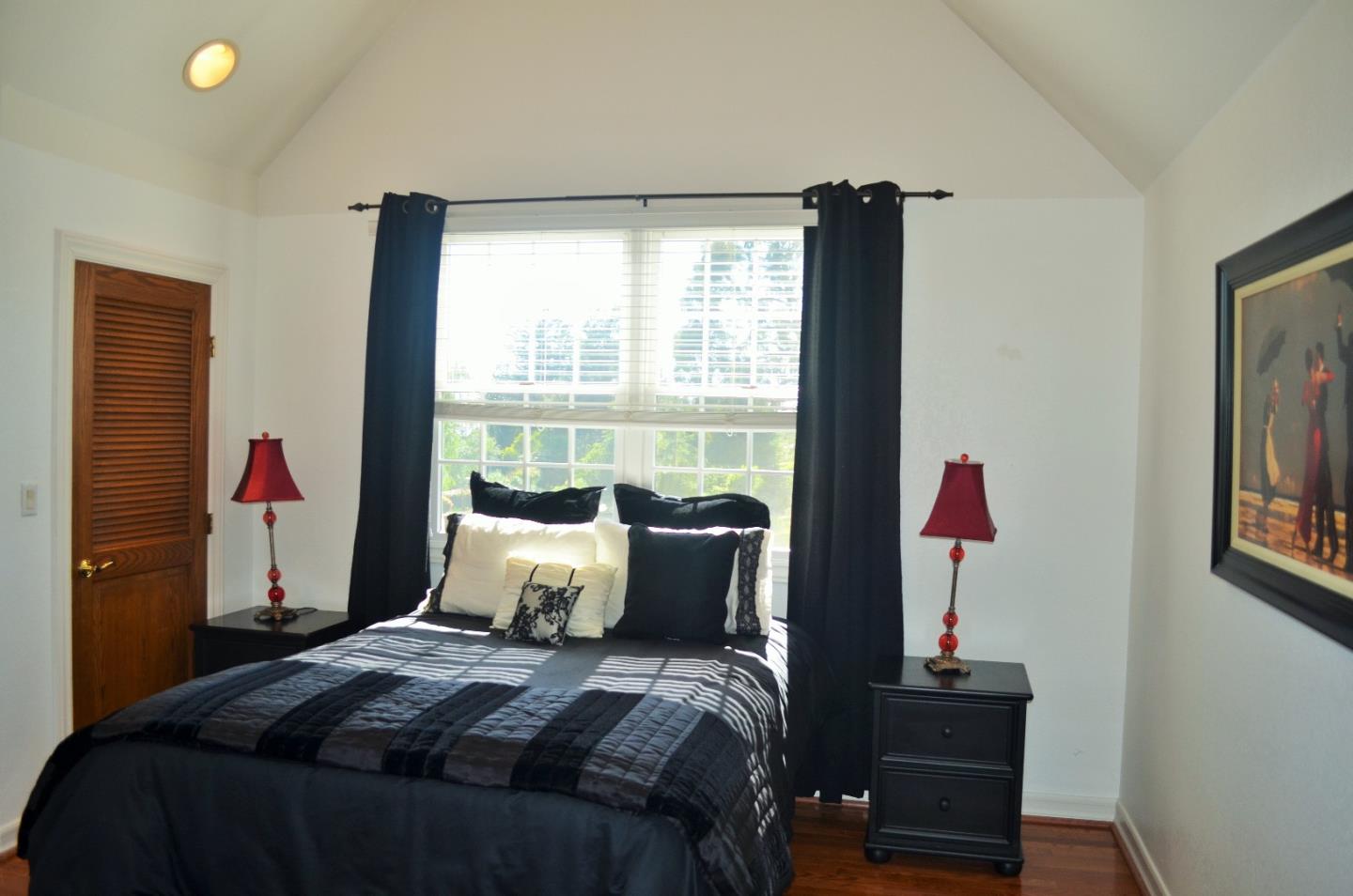 385 Tolak Road Aptos, CA 95003 - Photo 44 of 82 a bedroom with a bed and a window