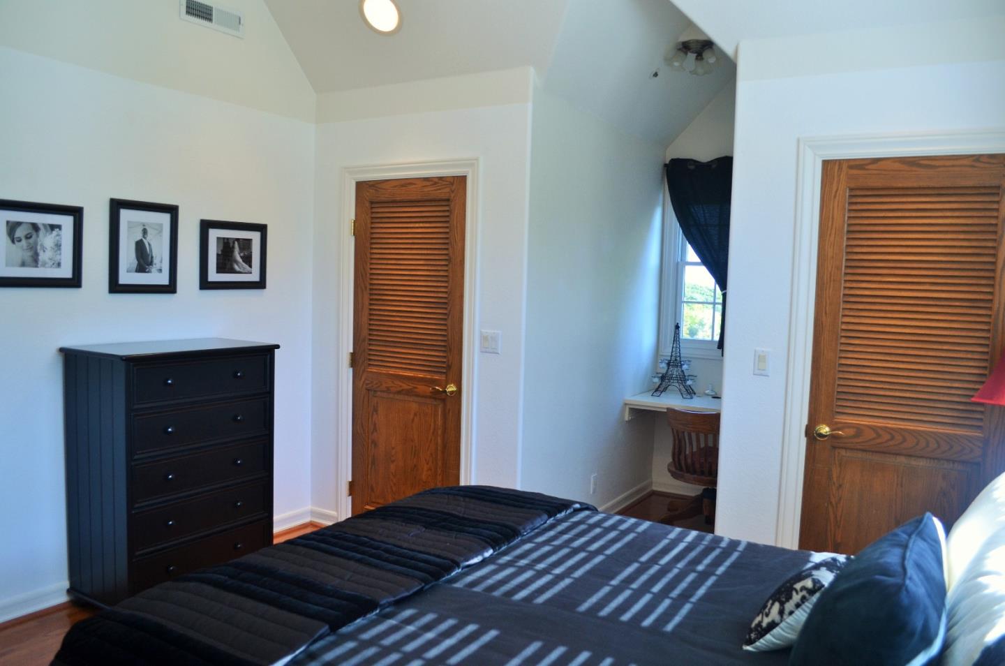 385 Tolak Road Aptos, CA 95003 - Photo 45 of 82 a bedroom with a bed and a lamp