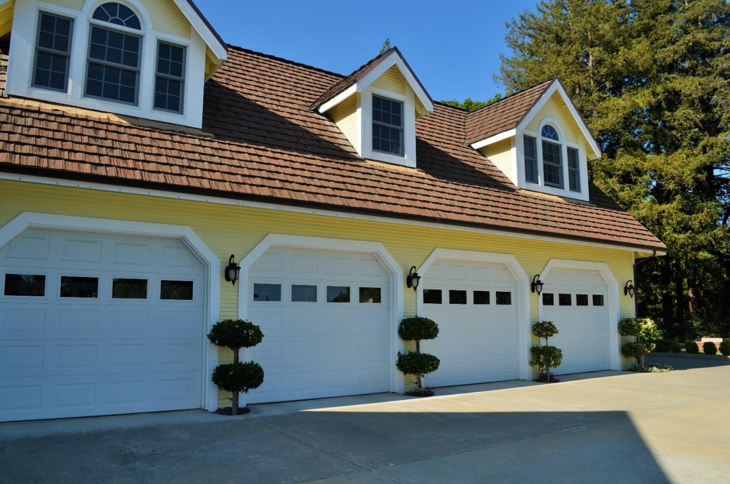385 Tolak Road Aptos, CA 95003 - Photo 62 of 82 a front view of a building with a garden and garage