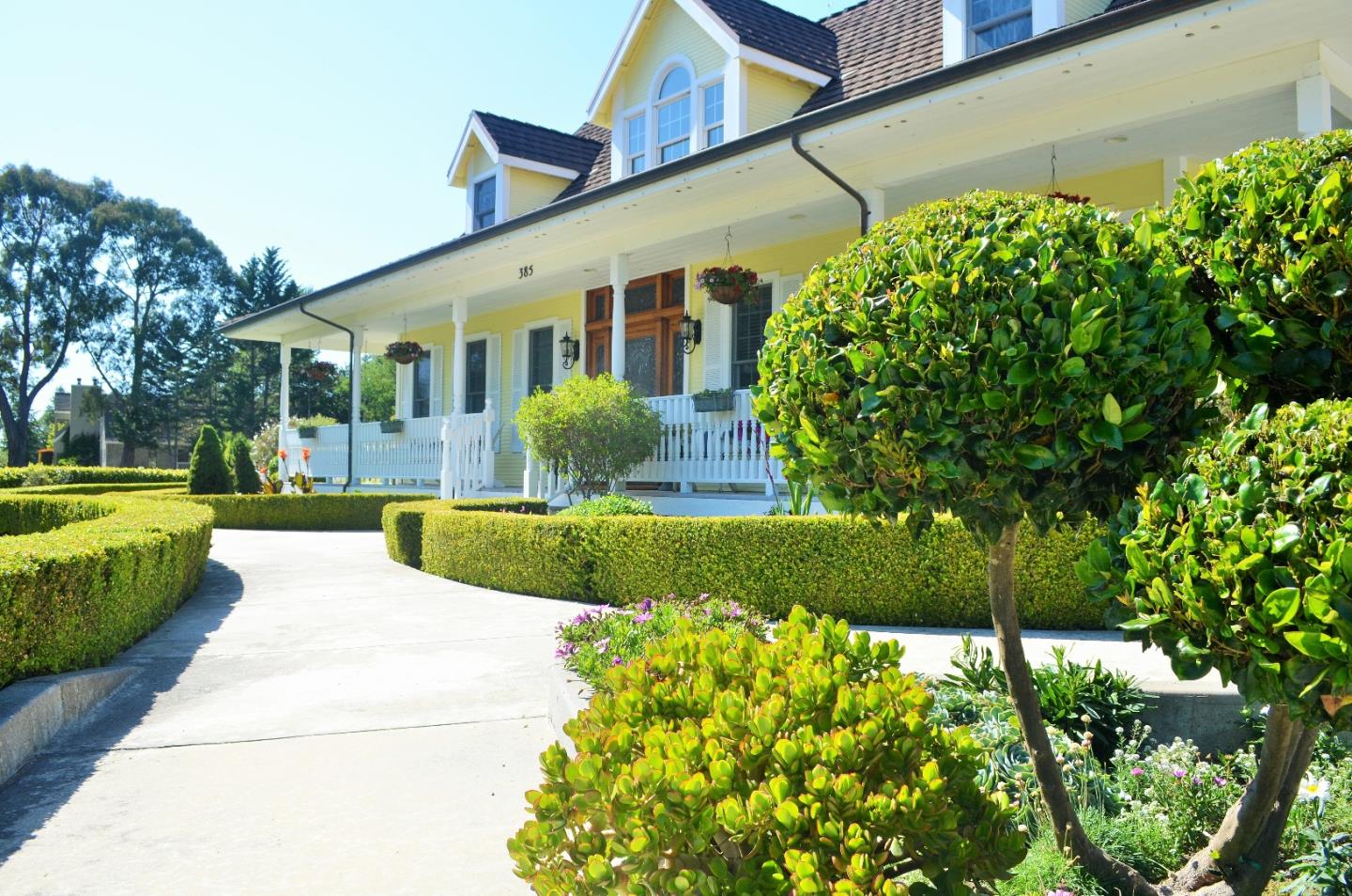 385 Tolak Road Aptos, CA 95003 - Photo 7 of 82 a front view of a house with a yard and fountain
