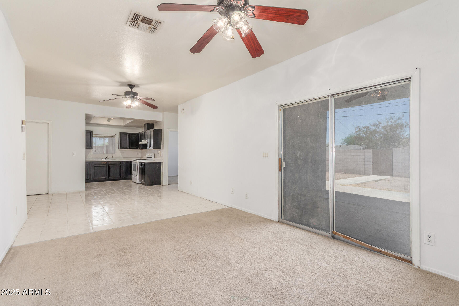 8676 West Mountain View Road Peoria, AZ 85345 - Photo 11 of 33 a view of a kitchen and a ceiling fan a kitchen space with a sink