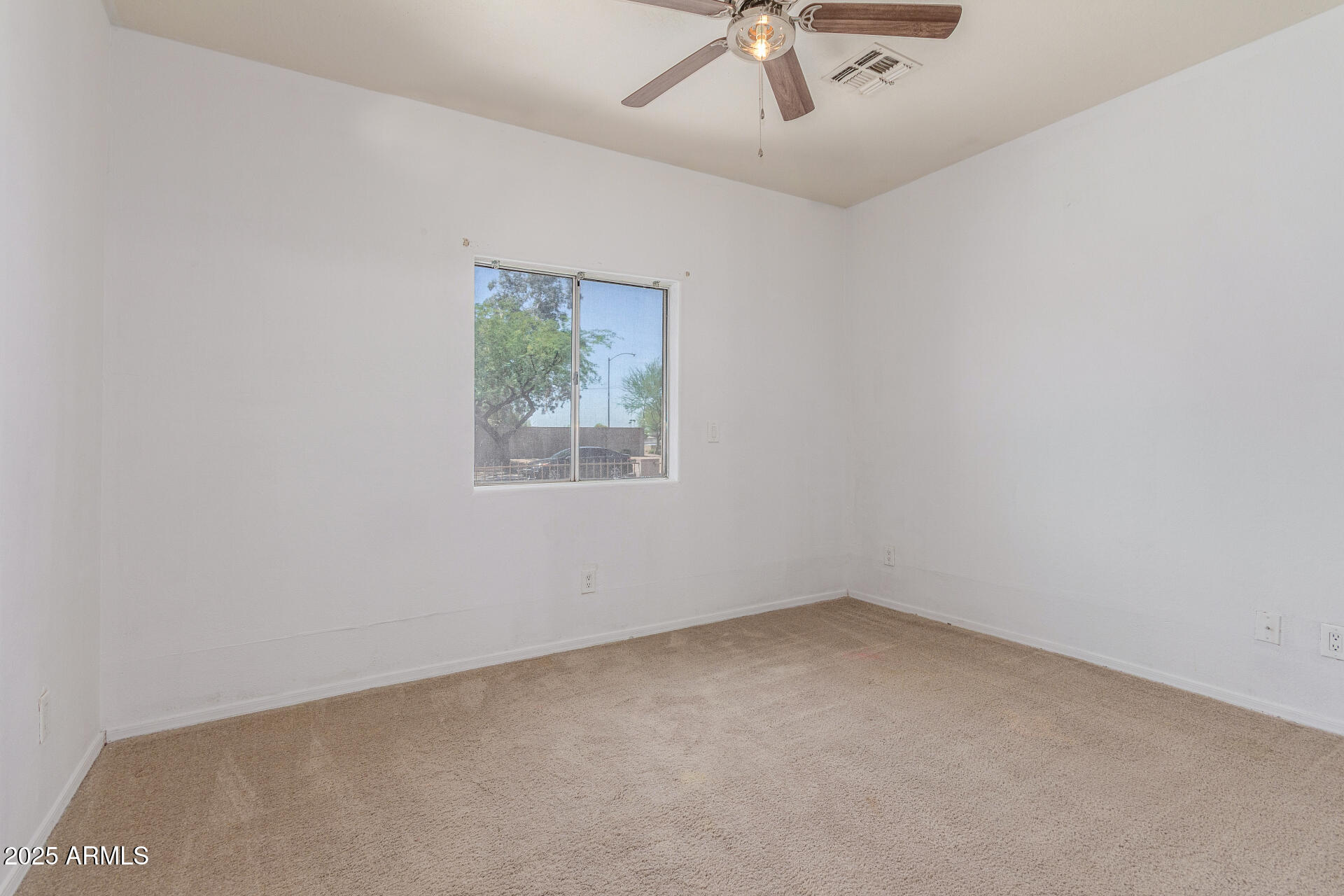 8676 West Mountain View Road Peoria, AZ 85345 - Photo 17 of 33 an empty room with a window