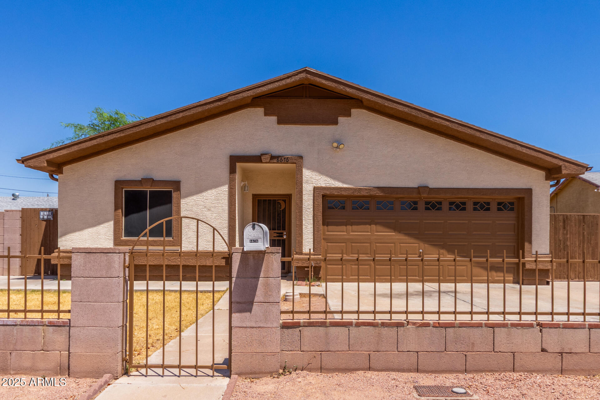 8676 West Mountain View Road Peoria, AZ 85345 - Photo 2 of 33 a front view of a house with a balcony
