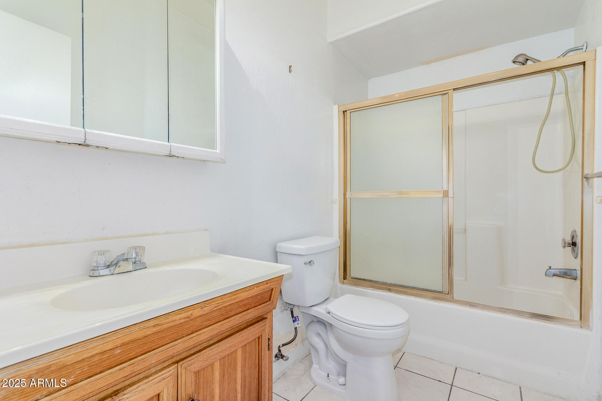 8676 West Mountain View Road Peoria, AZ 85345 - Photo 25 of 33 a bathroom with a sink a toilet and shower