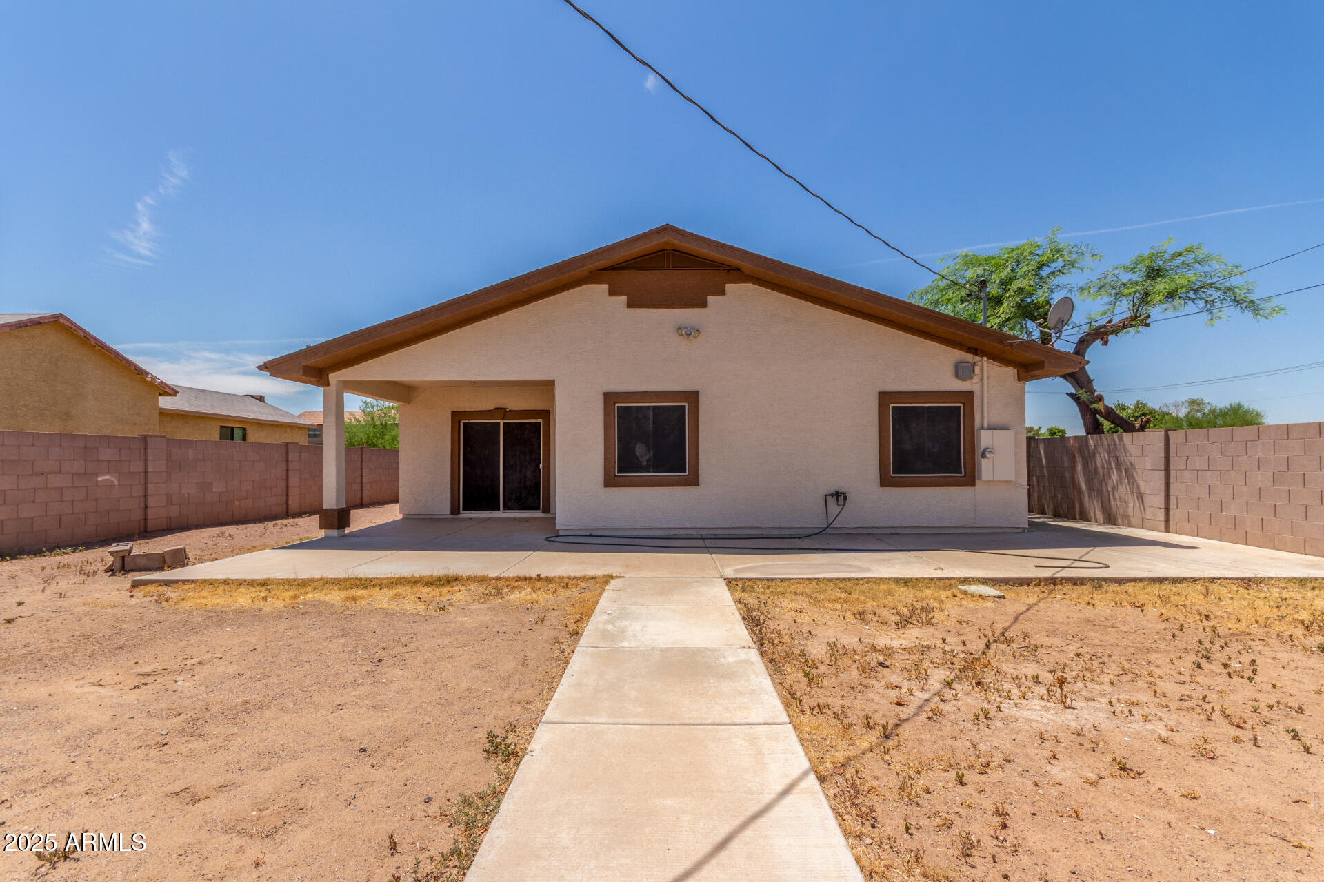 8676 West Mountain View Road Peoria, AZ 85345 - Photo 32 of 33 a front view of a house with a yard and garage
