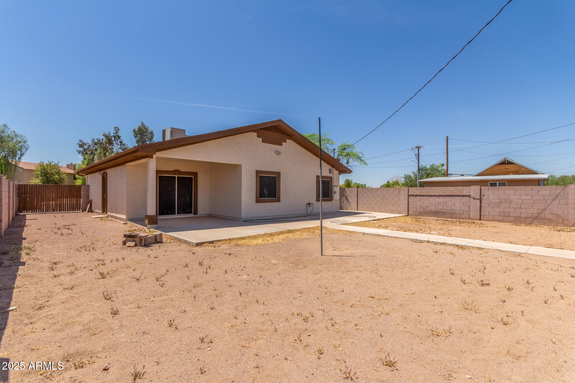 8676 West Mountain View Road Peoria, AZ 85345 - Photo 33 of 33 a view of a house with wooden fence