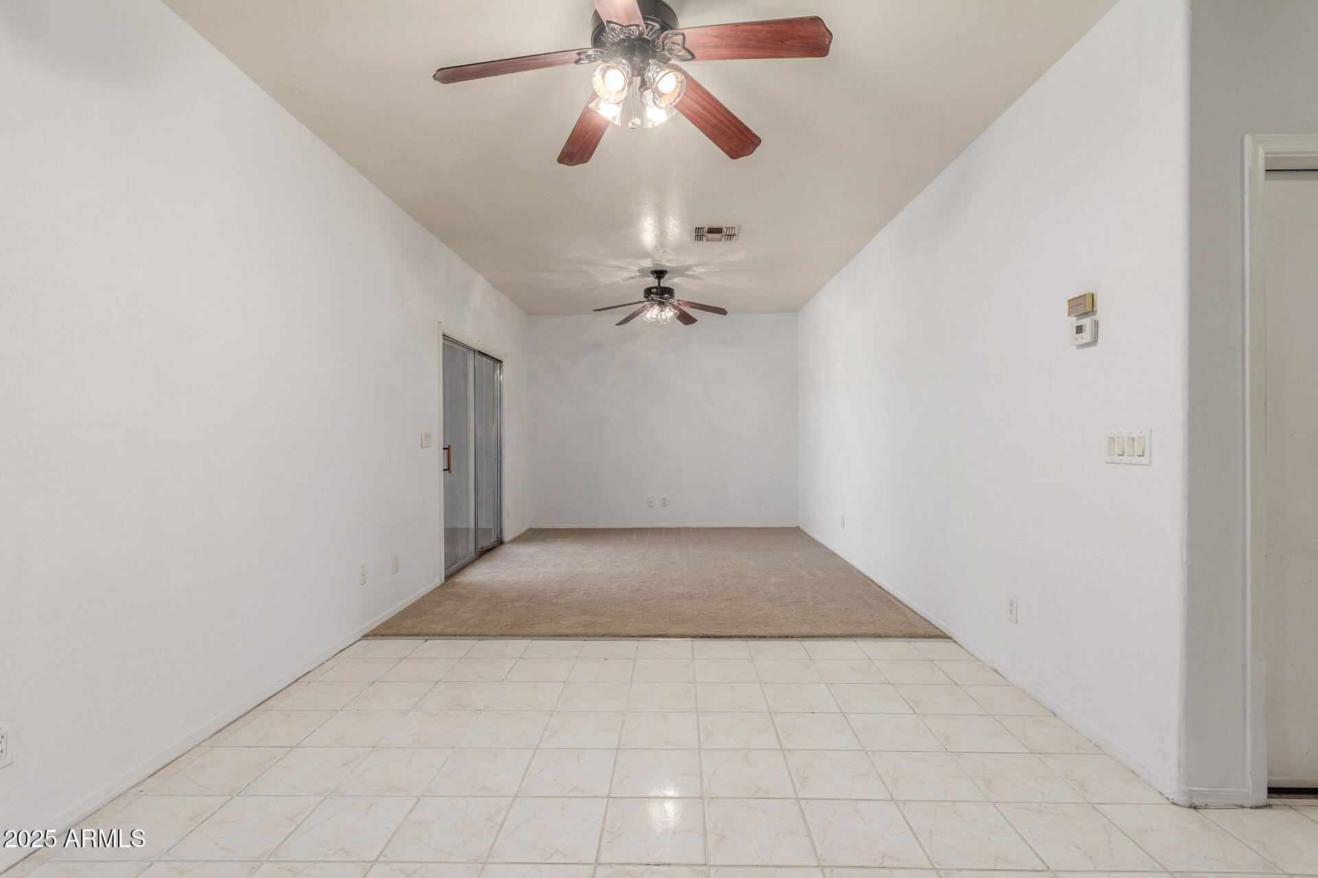 8676 West Mountain View Road Peoria, AZ 85345 - Photo 10 of 33 an empty room with fan and windows