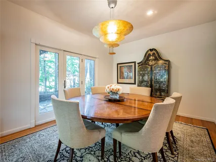 a view of a dining room with furniture window and outside view