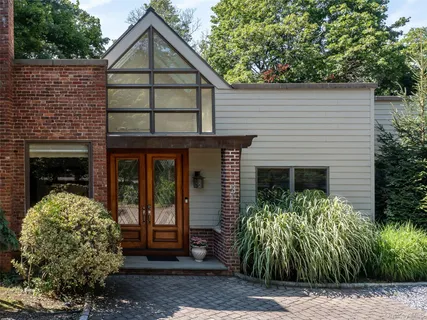 a front view of a house with garden