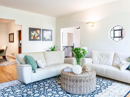 a living room with furniture a rug and a couch
