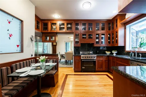 a kitchen with a sink and a stove top oven