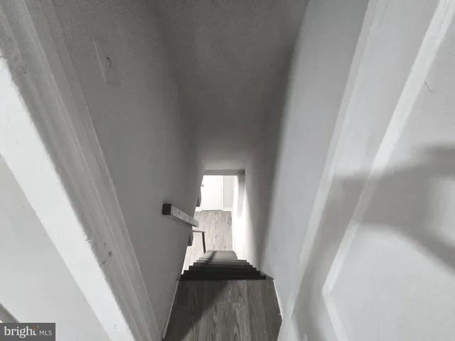 a view of entryway with stairs and a window