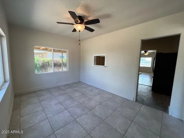 a view of an empty room with a window