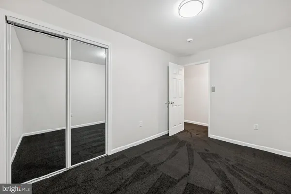 an empty room with wooden floor
