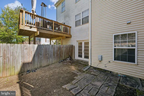 a view of a pathway with a house in the background