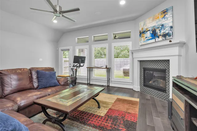 a living room with a couch and kitchen view